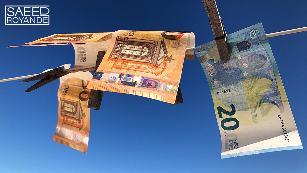 Euro banknotes pegged to a clothesline drying