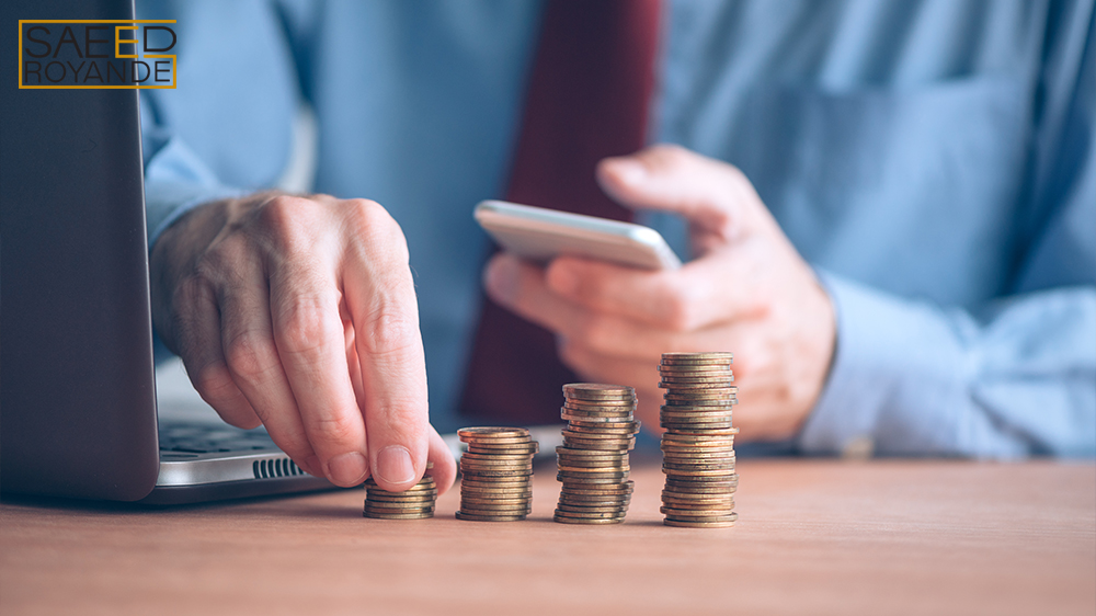 Finances and budgeting businessman stacking coins