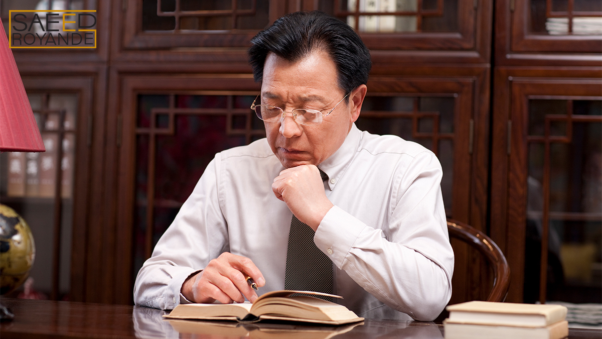 Businessman reading a book