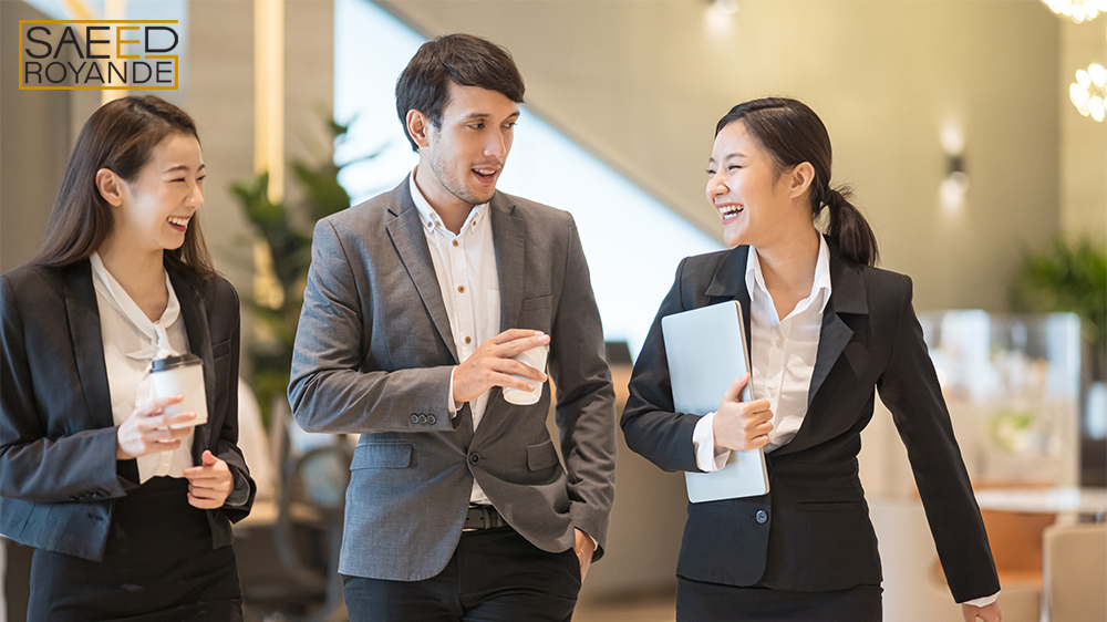 Businessman and Businesswoman talking when walking