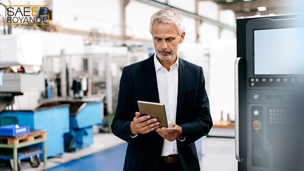 Manager using digital tablet in high tech company