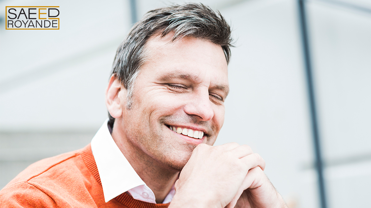 Businessman wearing orange sweater