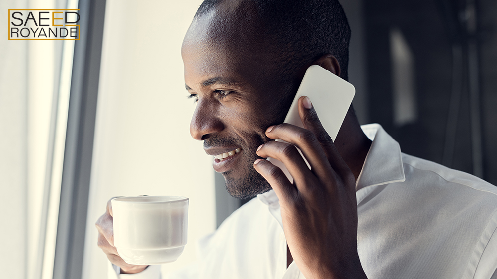 Smiling young businessman in white shirt with good energy