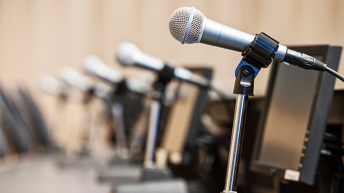 Microphones at a political meeing in city hall