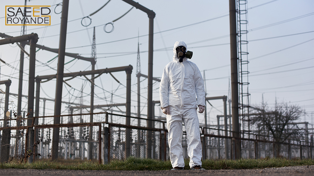 Scientist standing on territory of electric power