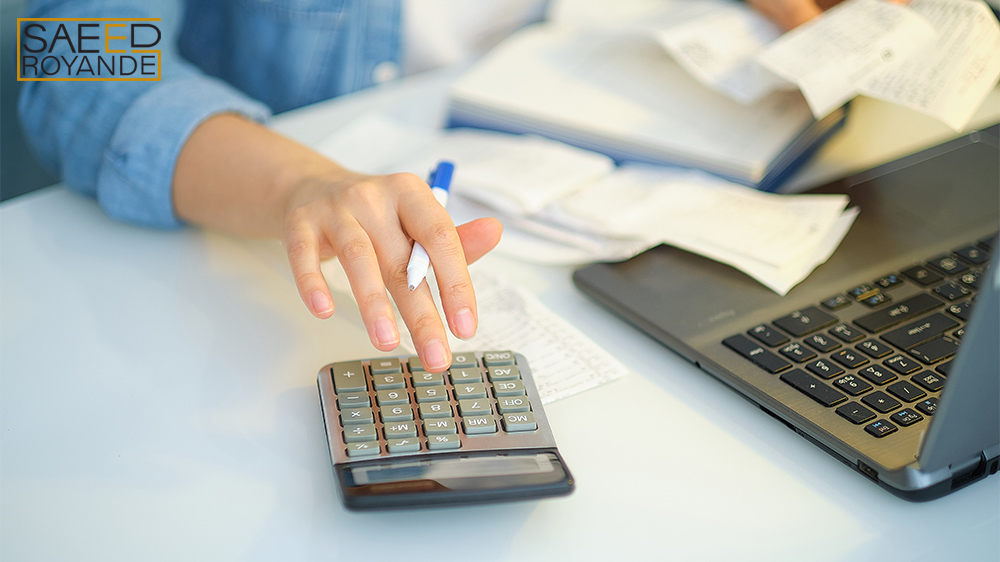 Woman holding the bills to calculate