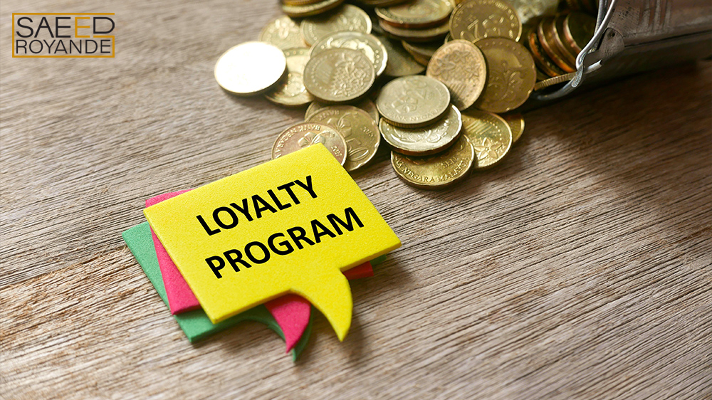 Gold coins and a stack of speech bubbles written loyalty program