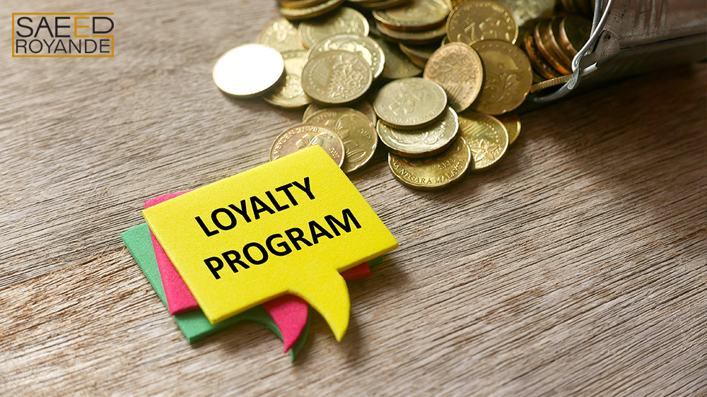 Gold coins and a stack of speech bubbles written loyalty program